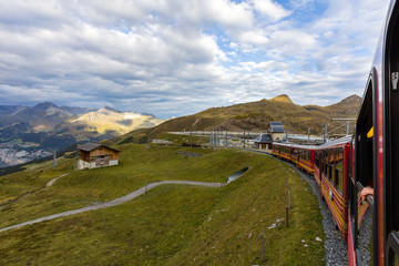 Fototapeta na wymiar A Swiss train heading towards Jungfrau in Swiss Alps.