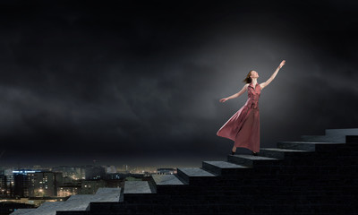 Obraz na płótnie Canvas Woman running on stairs