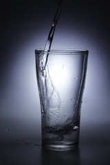 pouring cold water into a glass