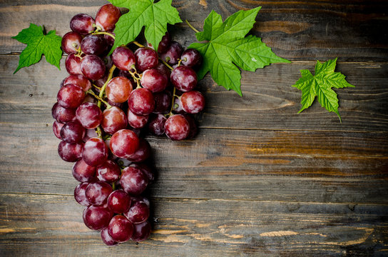 Fresh Red Grape On Wooden Background