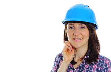 Smiling builder woman wearing protective blue helmet