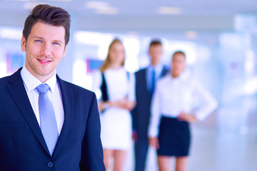 Smiling successful business team standing in office