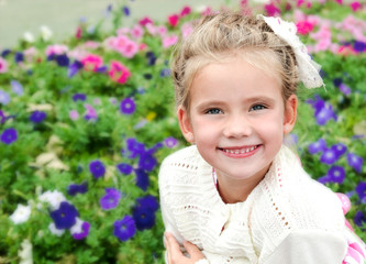 Portrait of smiling cute little girl in summer day