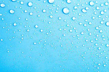 Drops of water on a color background. Blue. Shallow depth of fie - 91237697