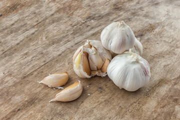Fresh garlic isolated on wooden background