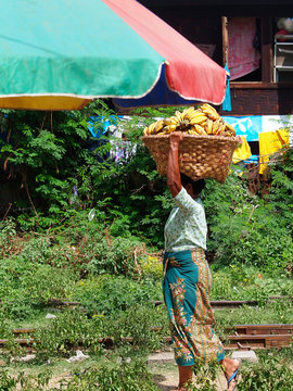 Myanmar, woman carrying on the head
