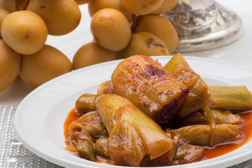 Cooked green onions. simanim-Traditional food for Rosh Hashanah (In Hebrew carti)