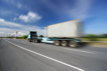 Generic big trucks speeding on the highway at sunset - Transport industry concept , big truck containers