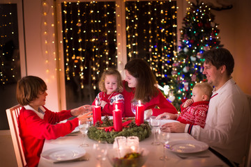 Family enjoying Christmas dinner at home