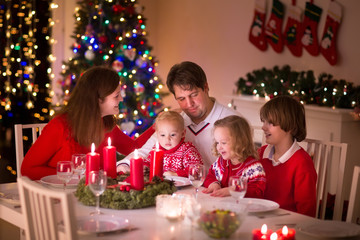 Family enjoying Christmas dinner at home