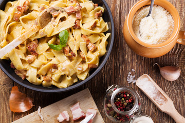Pasta Carbonara with bacon, basil and cheese