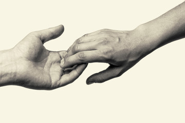 Black and white toned photo with two hands (farewell touch lovers)