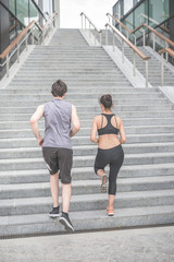Obraz premium Rear view of couple exercising on steps