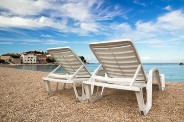 Two deckchairs on a beautiful adriatic beach