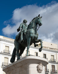 Fototapeta na wymiar Statue of Charles III one of the famouse King of Spain on Puerta del Sol square in Madrid, Spain