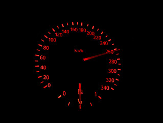 Red symbols on the speedometer of sport car 