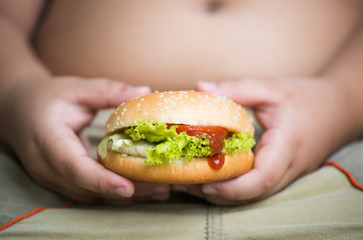 chicken cheese Hamburger on obese fat boy hand