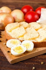 Boiled quail eggs and bread with Romadur cheese