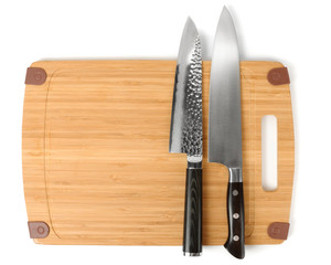 Two knives on a cutting board