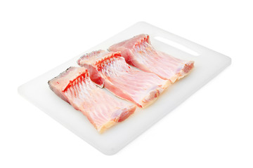 Three carp fillets on white background. In Central Europe ( Poland and Czech Republic ), fish is a traditional part of a Christmas Eve dinner.