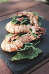 Grilled shrimps on slate plate