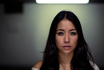 Pretty serene dark haired young woman
