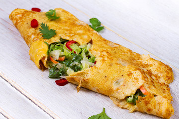 Filled Omelette with Onion, Carrot, Avocado, Cabbage Coriander, Chilli, Yoghurt