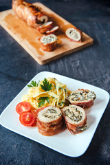 Rolled meat and spaghetti