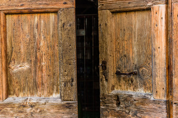 antique wooden door with woodworm holes