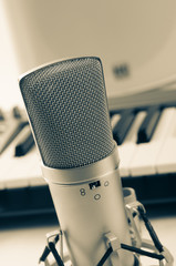 Microphone in recording studio on a white background. Vintage style.