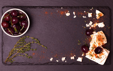Food frame on dark stone background.
