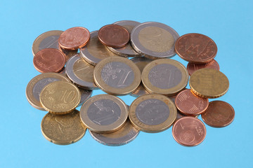 Close up photo of Euro coins on a blue chromakey background