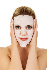 Young woman with facial mask
