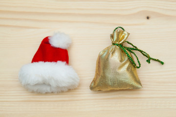 Christmas hat of Santa Claus and bag with gifts