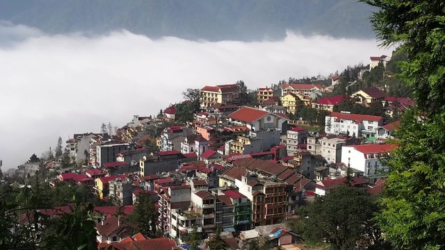Time lapse view of clouds covering the hill town of Sapa, Lao Cai Province, North Vietnam.