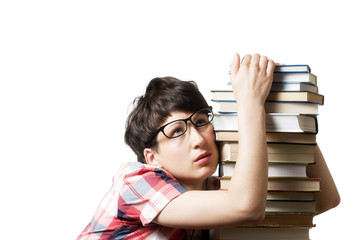 Tired girl near a pile of books
