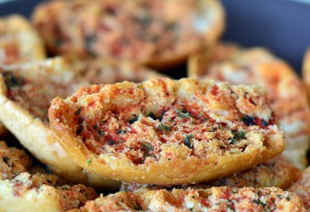 Italian bruschetta bread with tomato and oregano on a plate