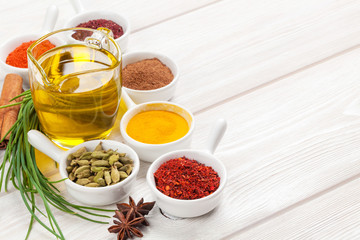 Various spices on white wooden background