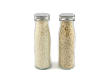 Rice in bottles, rice, milled rice on white background.