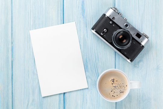 Blank photo frame, camera and coffee cup