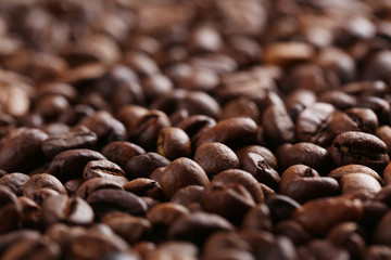 Roasted coffee beans background, close up