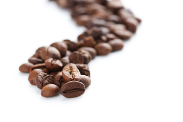 Roasted coffee beans on a white background