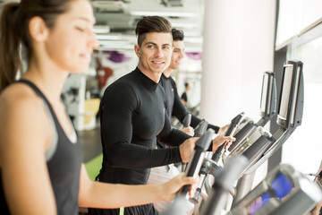 Fototapeta premium Young people training in the gym