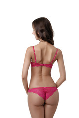 Fototapeta premium Rear view of slim brunette in sexy pink lingerie