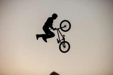 Extreme rider making a bike jump