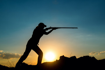 Female Hunter in Sunset