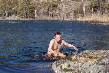 Fototapeta premium man in the cold water