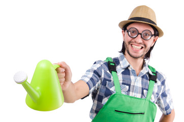 Young cheerful gardener with watering can isolated on white