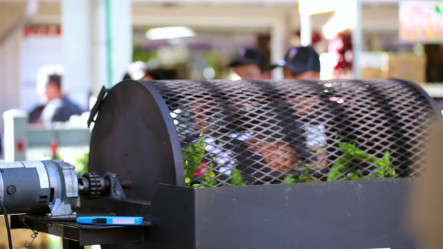 Roasting chili peppers in outdoor chili roaster