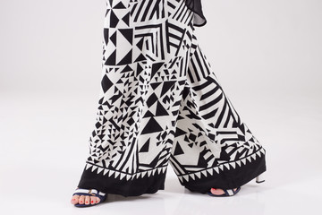 Fototapeta na wymiar Summer wide black and white trousers with pattern.
